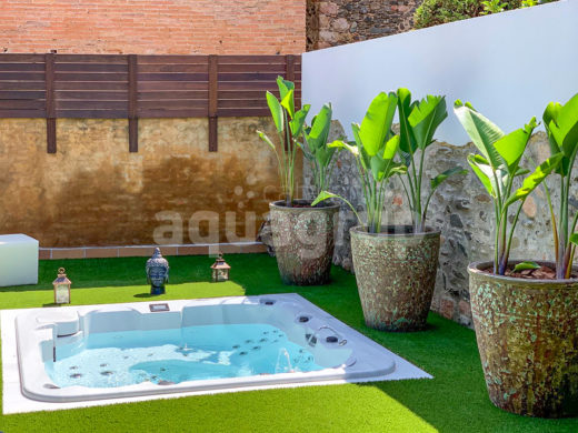 Outdoor spa installation embedded in garden